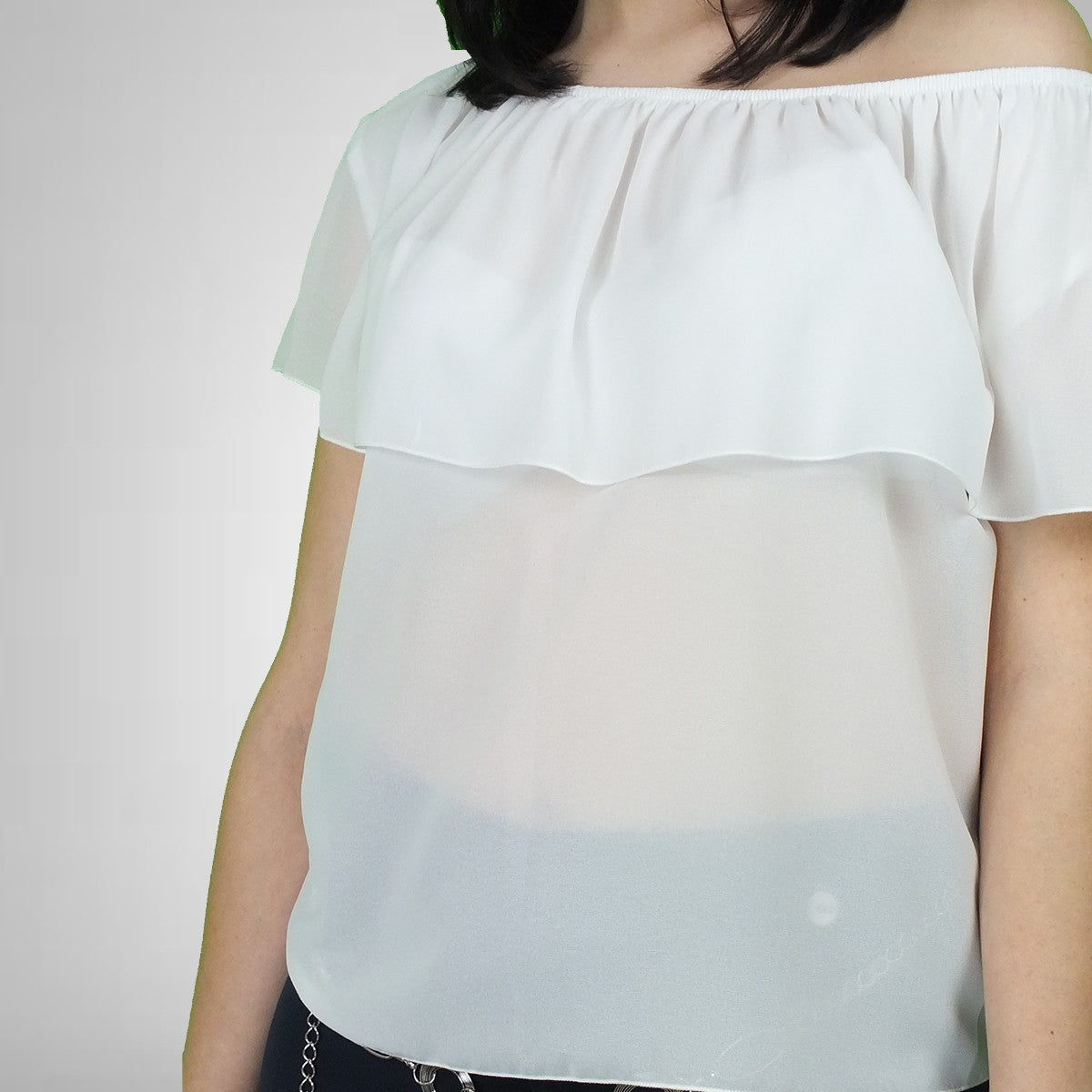 Blusa con volants Akè