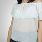 Blusa con volants Akè